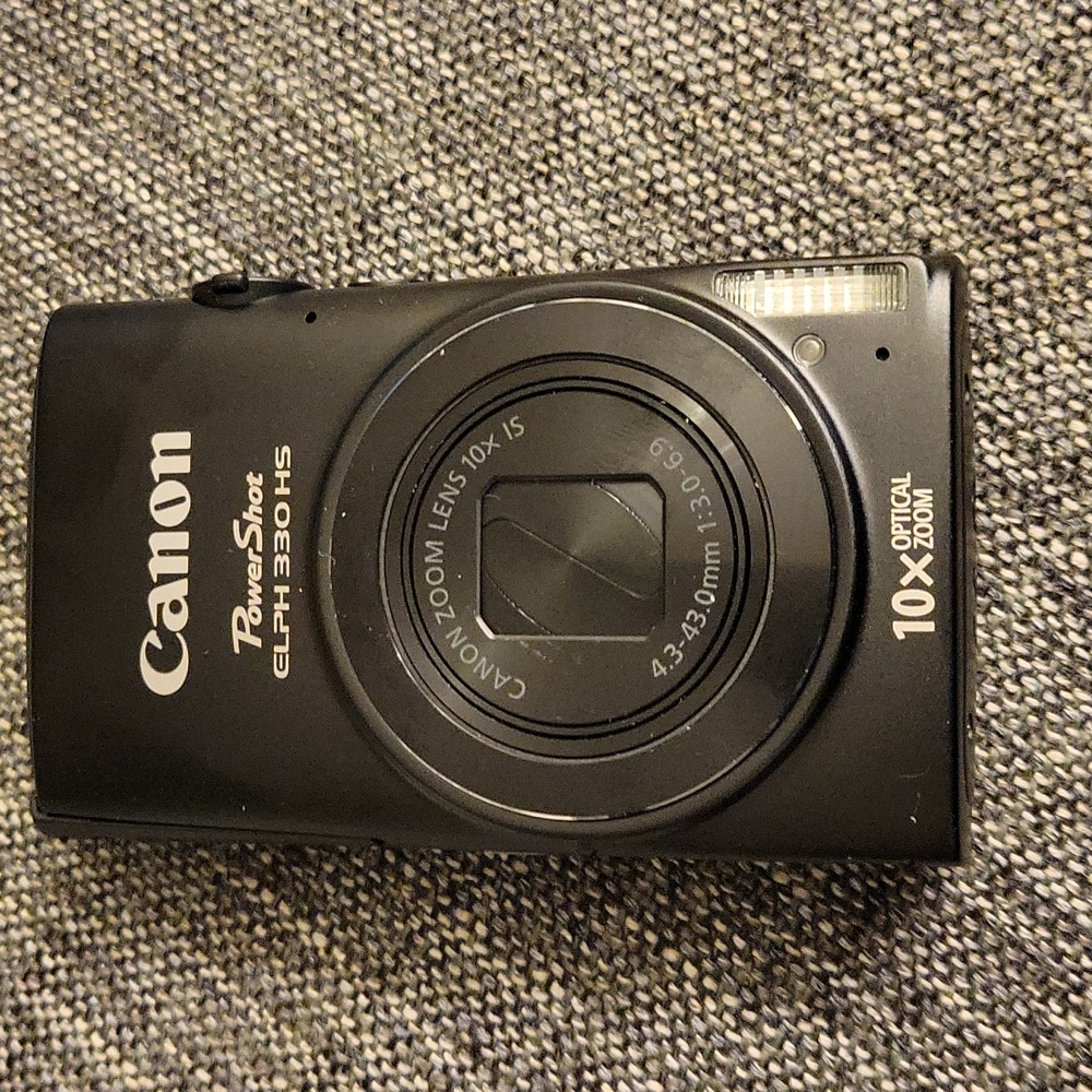 Canon Powershot Elph 330 has, black.  Almost new.  2gb memory card.